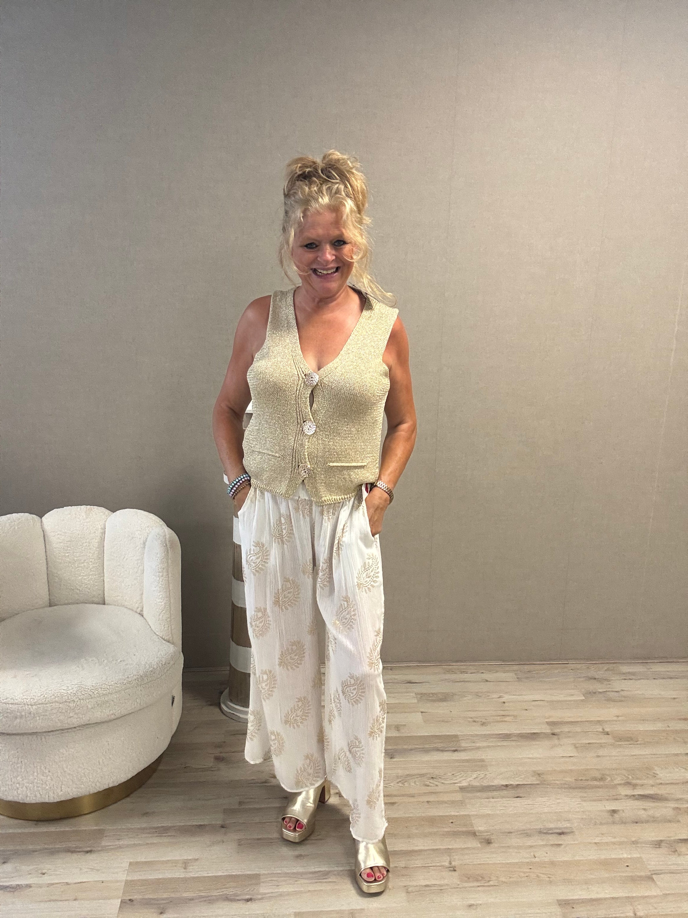 Lurex spencer met gouden knopen